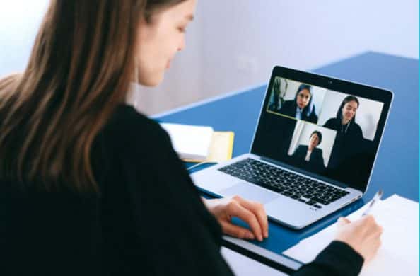 Image of person looking at video screen on a virtual conference