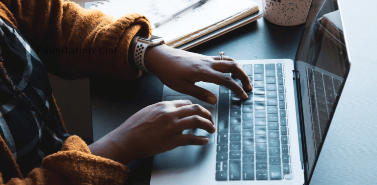 Image of nonprofit recruiter typing about nonprofit jobs above the blog Where To Find New Grants And Tips To Improve Your Grant Proposals