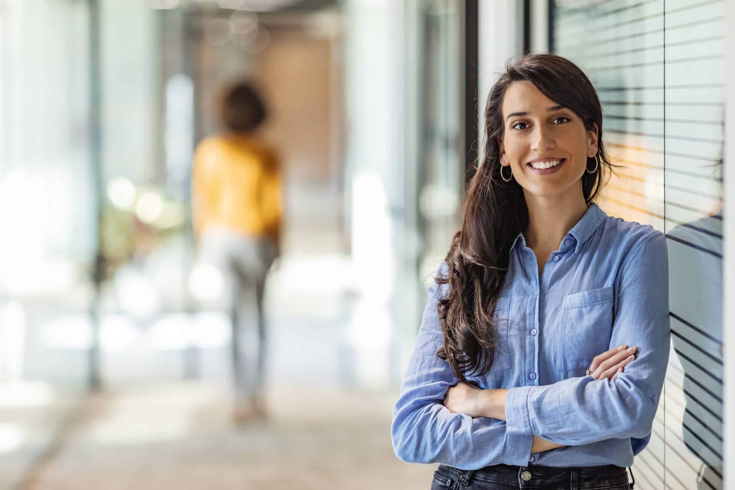 Nonprofit Executive Search Firm Recruiter Smiling & Standing Ready To Work