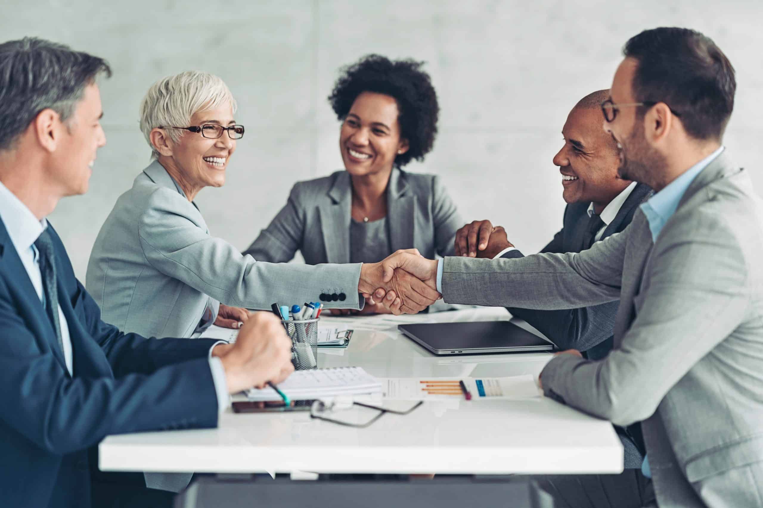 Nonprofit executive search team seen at an interview at a conference table