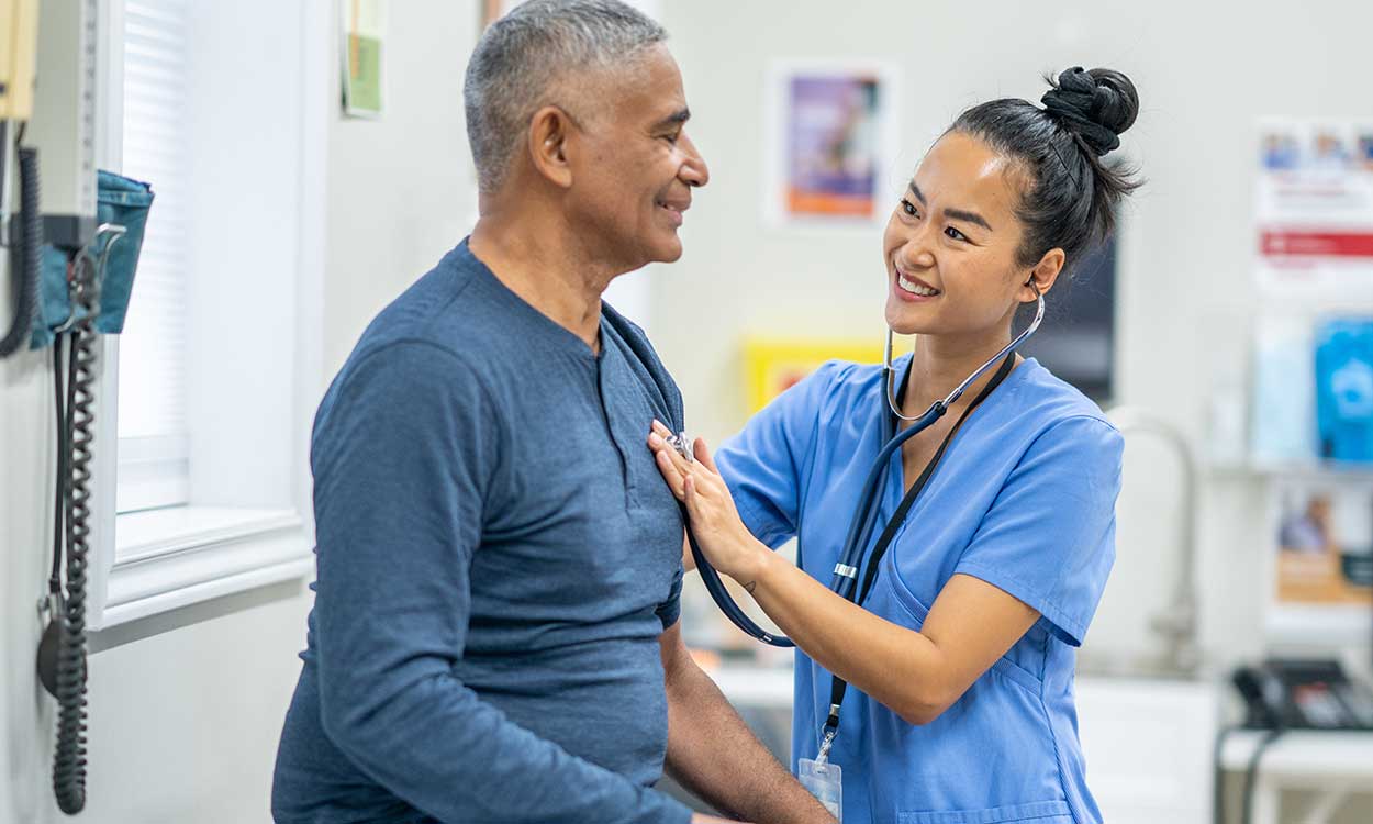 A nurse meastures a patient's heart rate