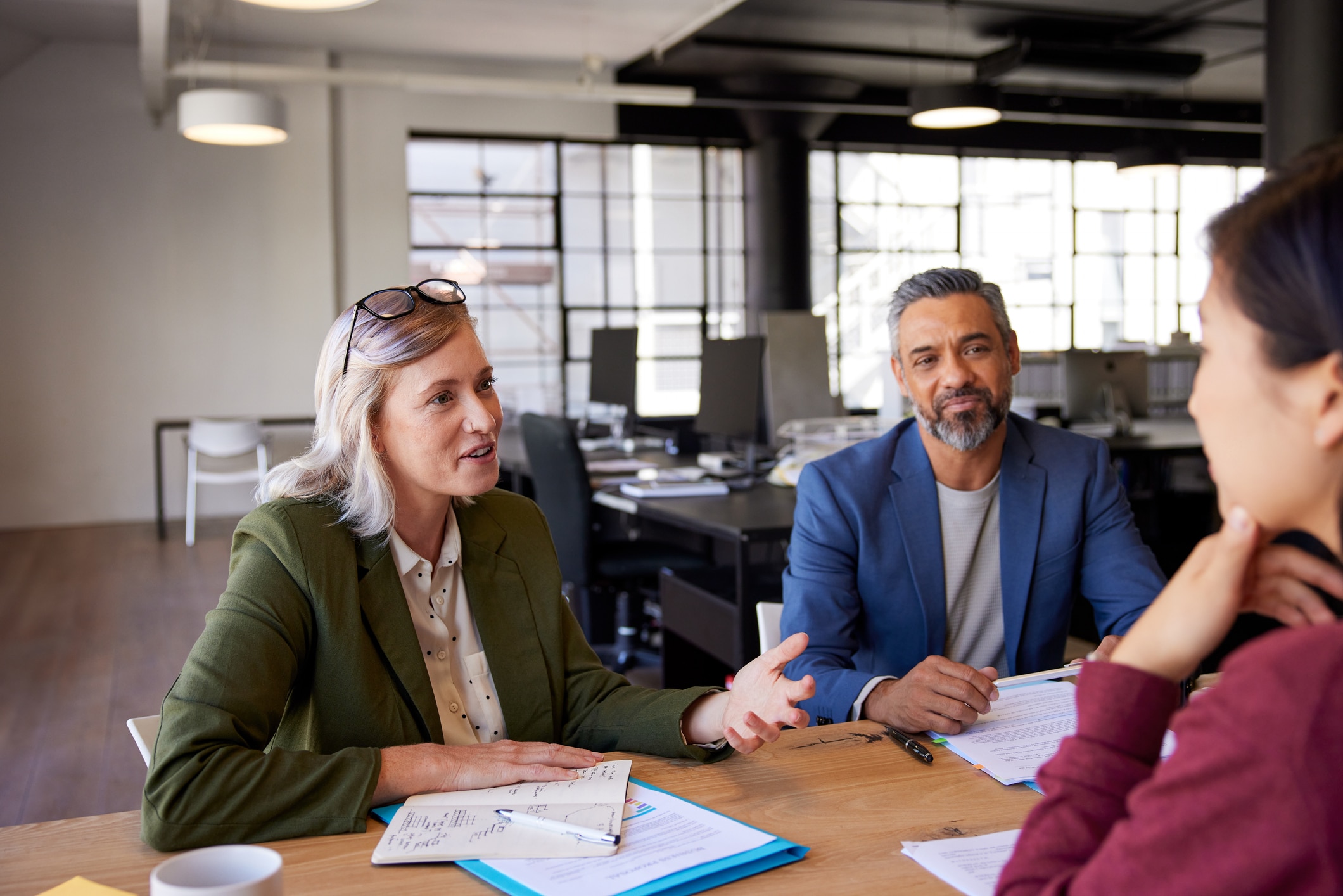 Nonprofit employer interviewing a smiling candidate for a mission-driven position