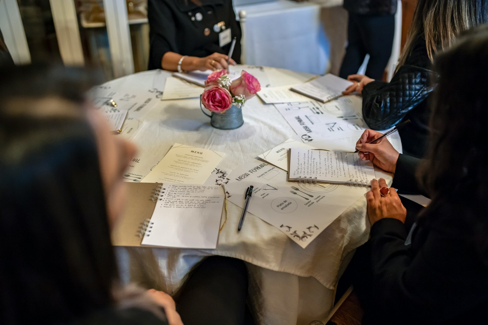 Fundraising Manager preparing a nonprofit donor engagement plan at a worktable