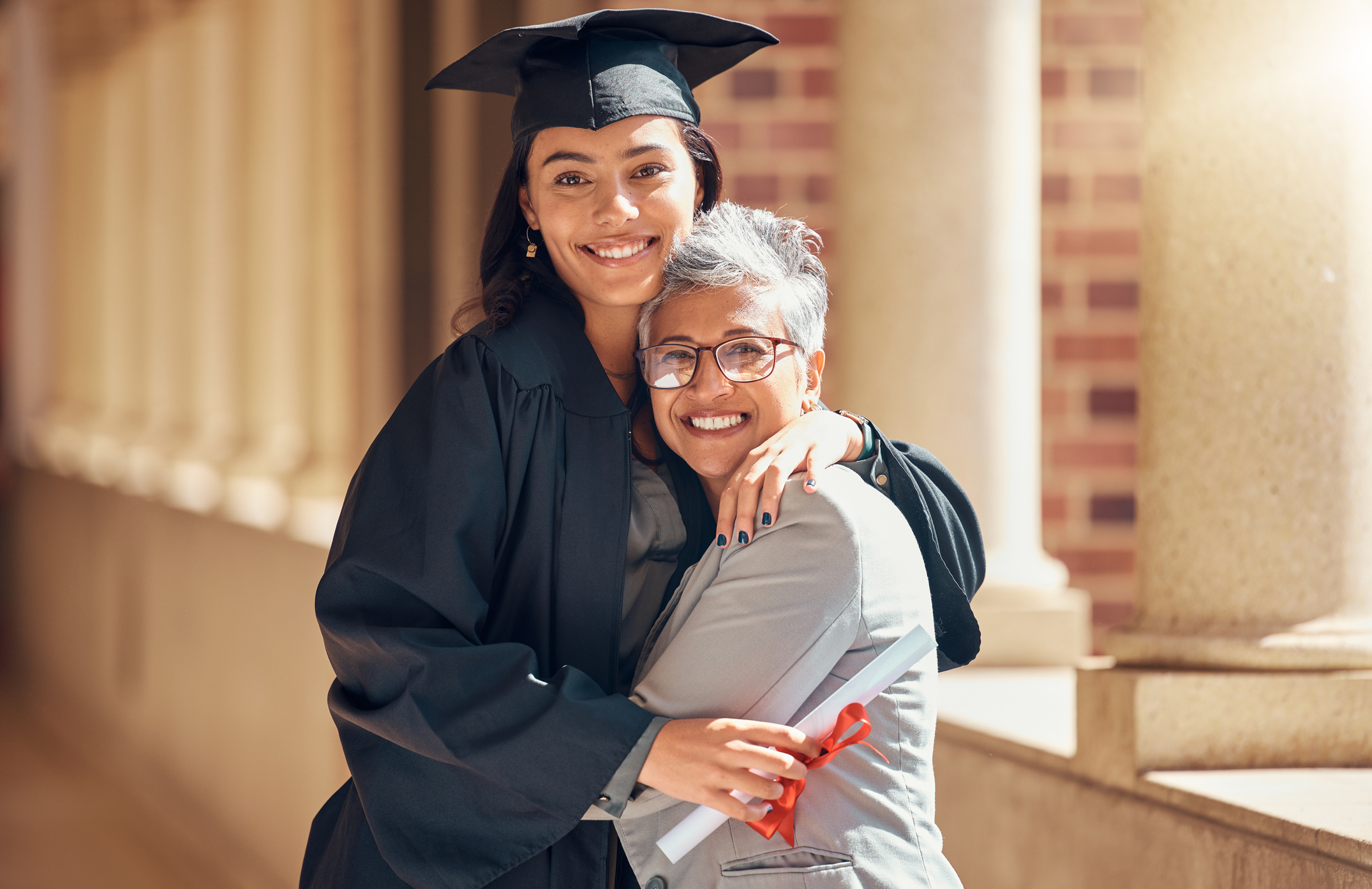 Dean congratulating a graduate as an example of education career impact