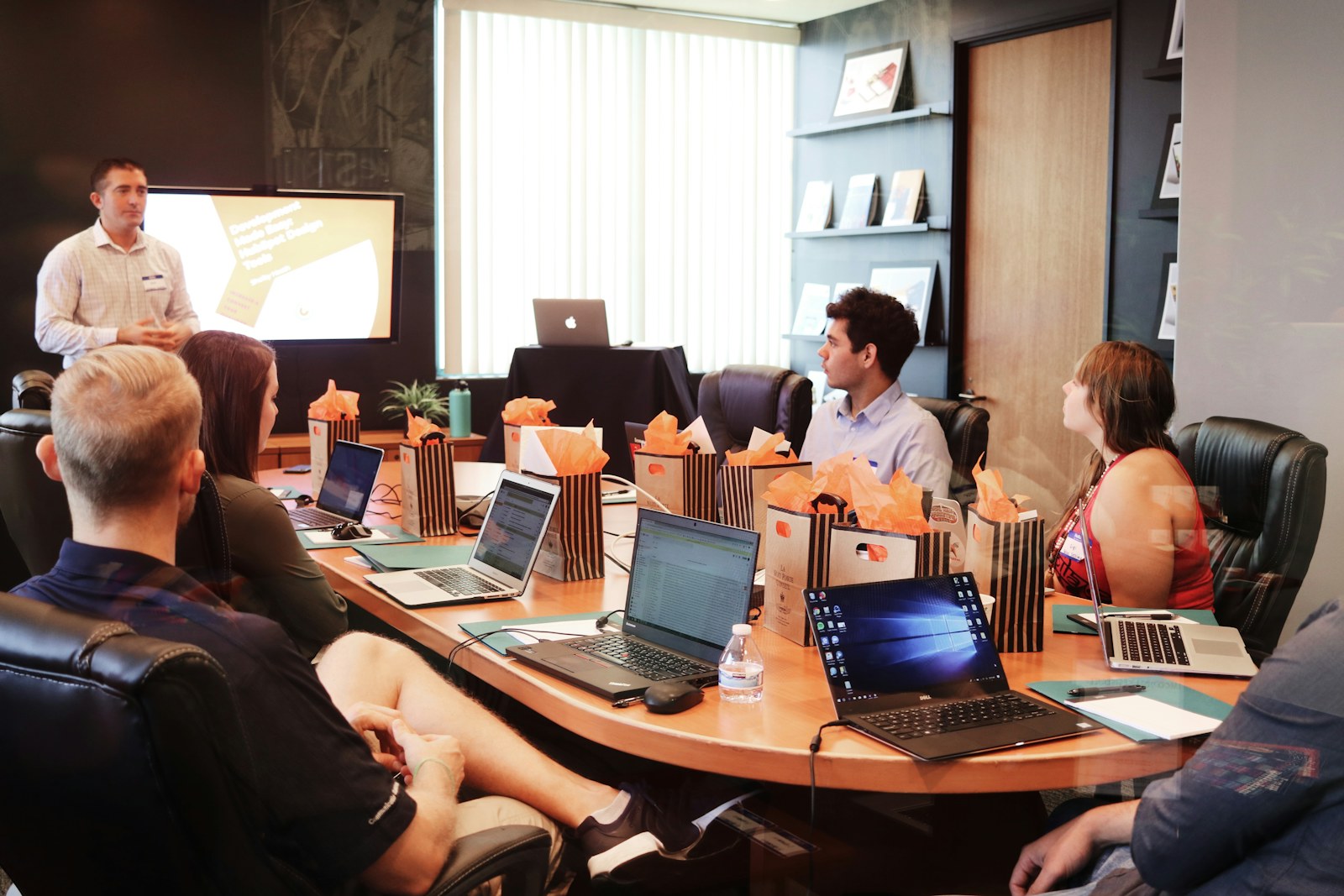 Nonprofit leadership team reviewing finance priorities during a hiring discussion