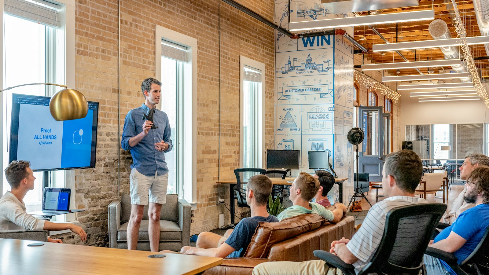 Nonprofit hiring team reviewing a job description in an office
