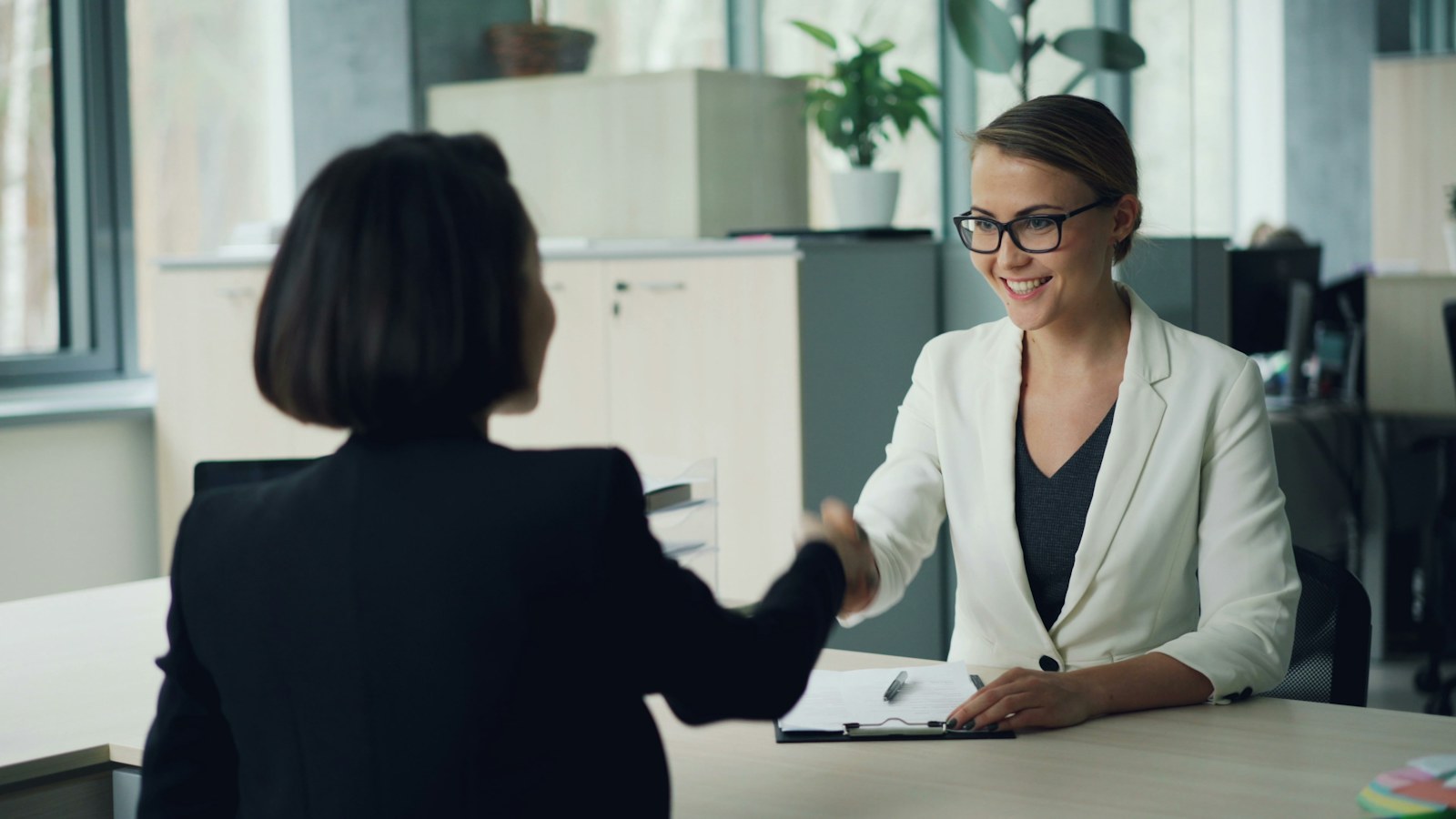 Professional discussing a career transition with an advisor