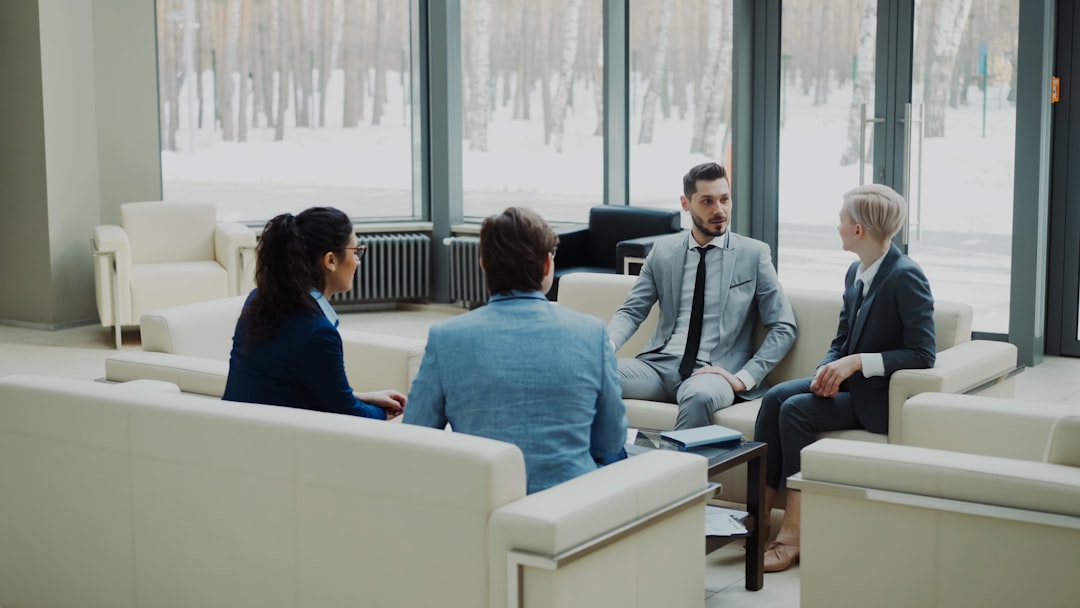 Candidate reviewing interview follow-up notes with a professional colleague