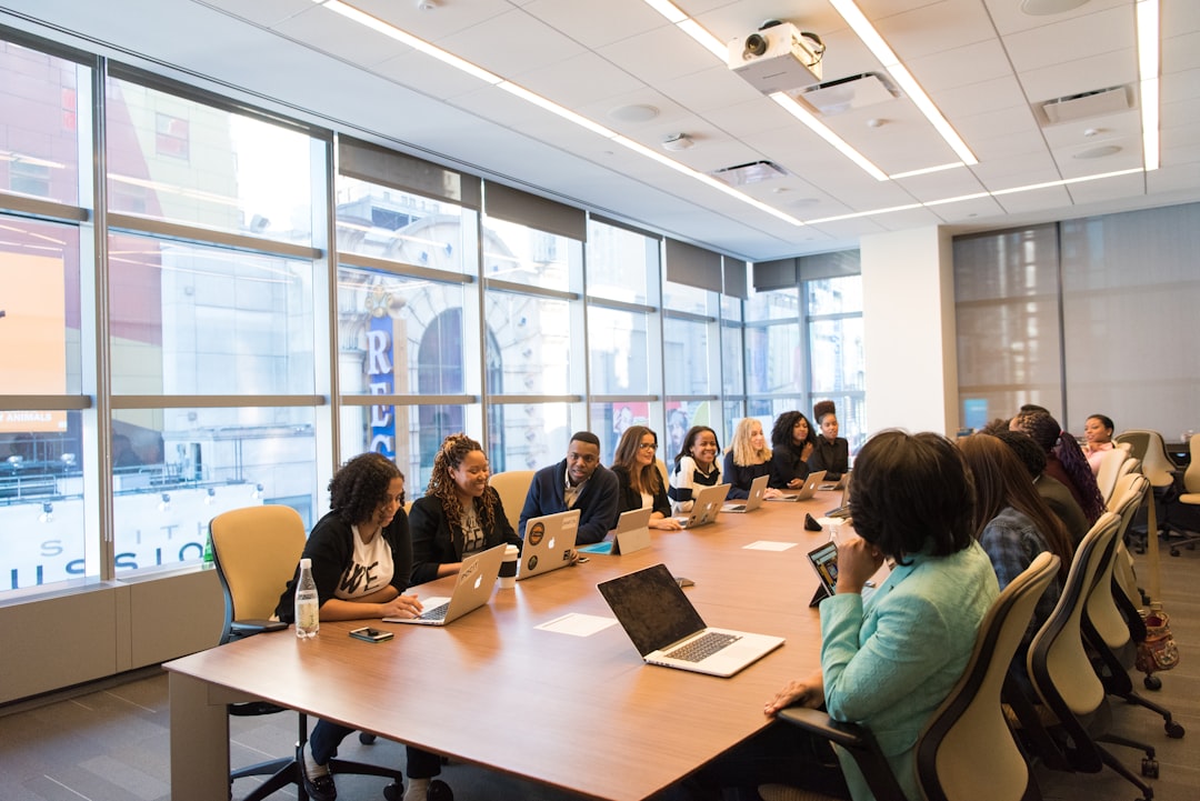 Nonprofit administrative professionals working together around an office table
