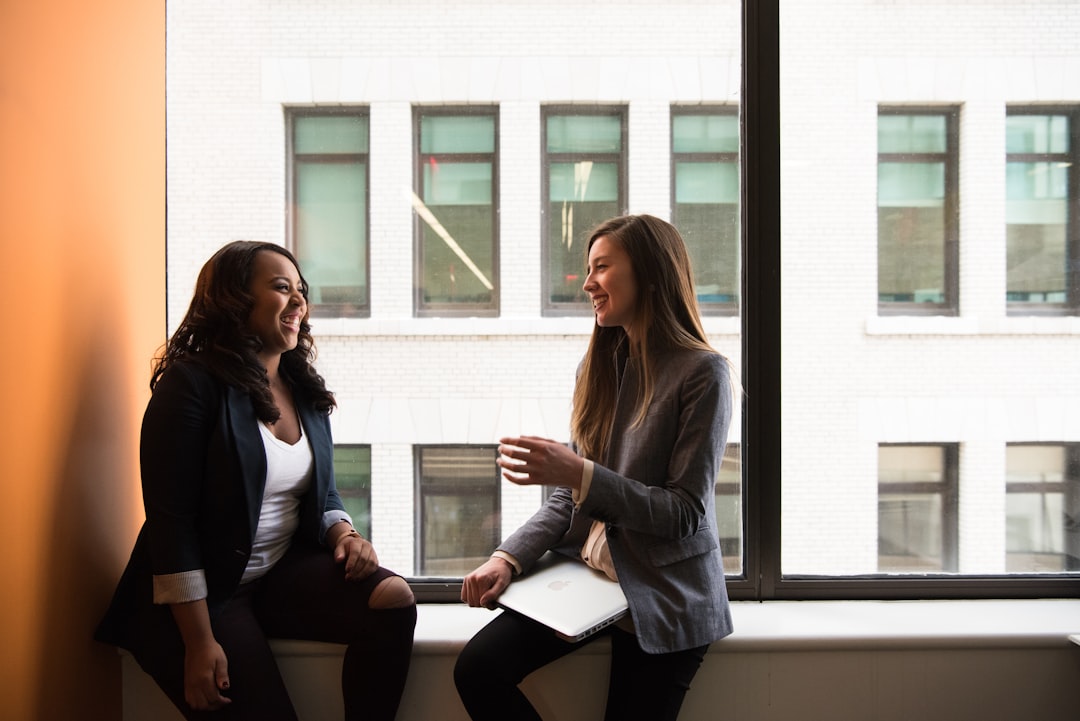 Nonprofit HR Manager having a supportive workplace conversation with an employee