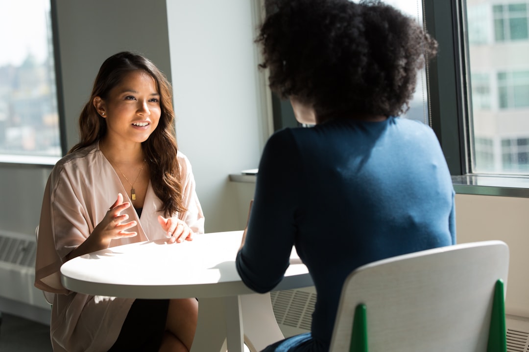 Early-career professional organizing a nonprofit job search with a mentor