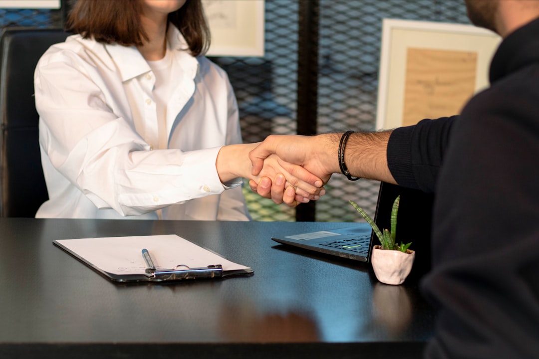 Candidate discussing a nonprofit job offer during an office interview