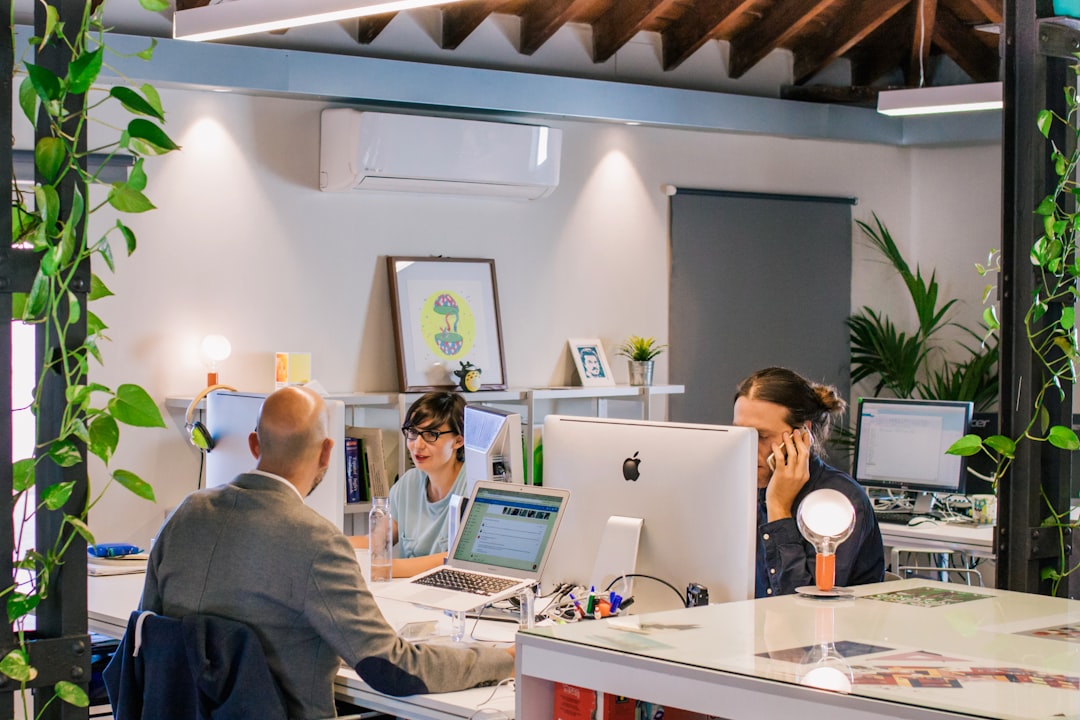Arts organization staff working together in a creative office environment