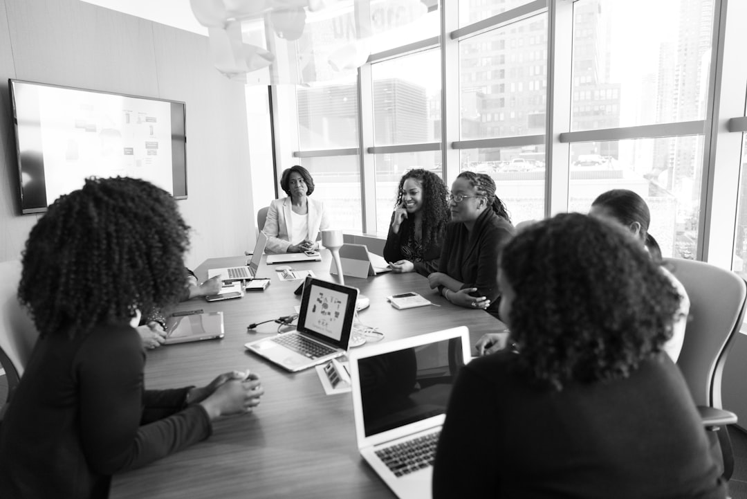 International development leaders collaborating around a workplace table