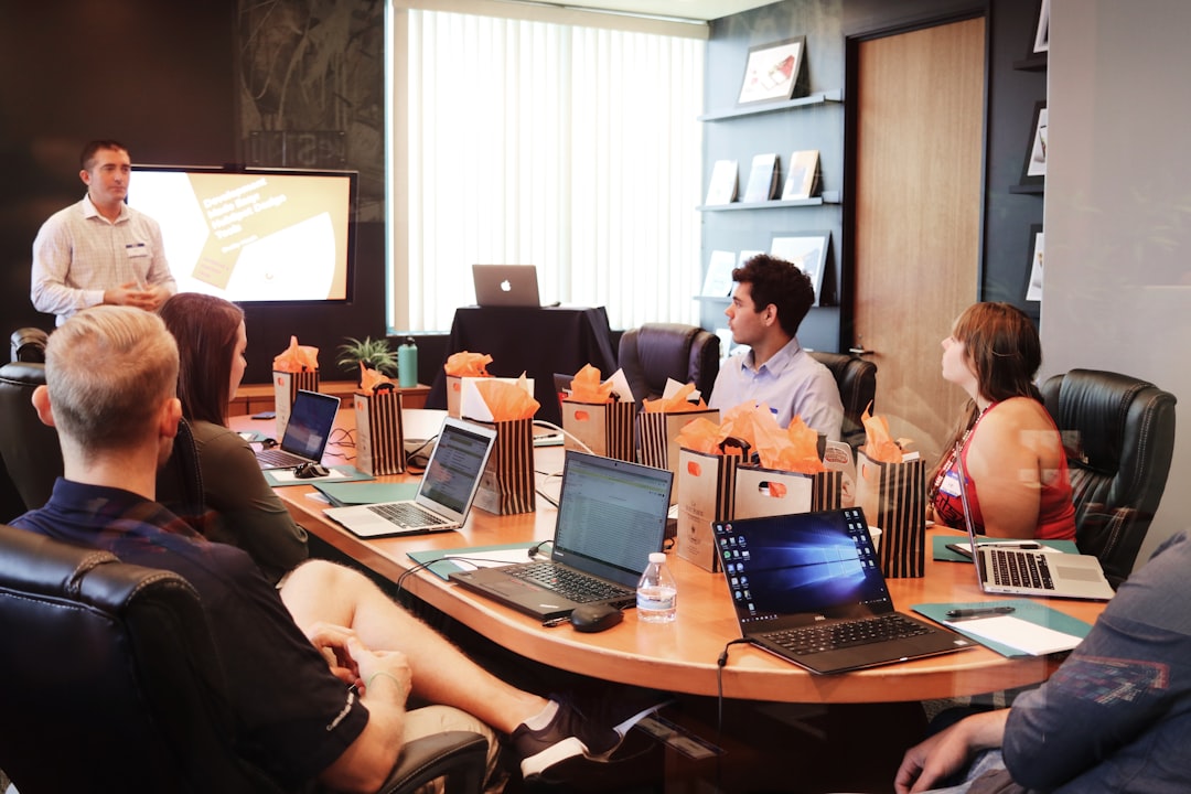 Program and evaluation professionals reviewing findings during an office presentation