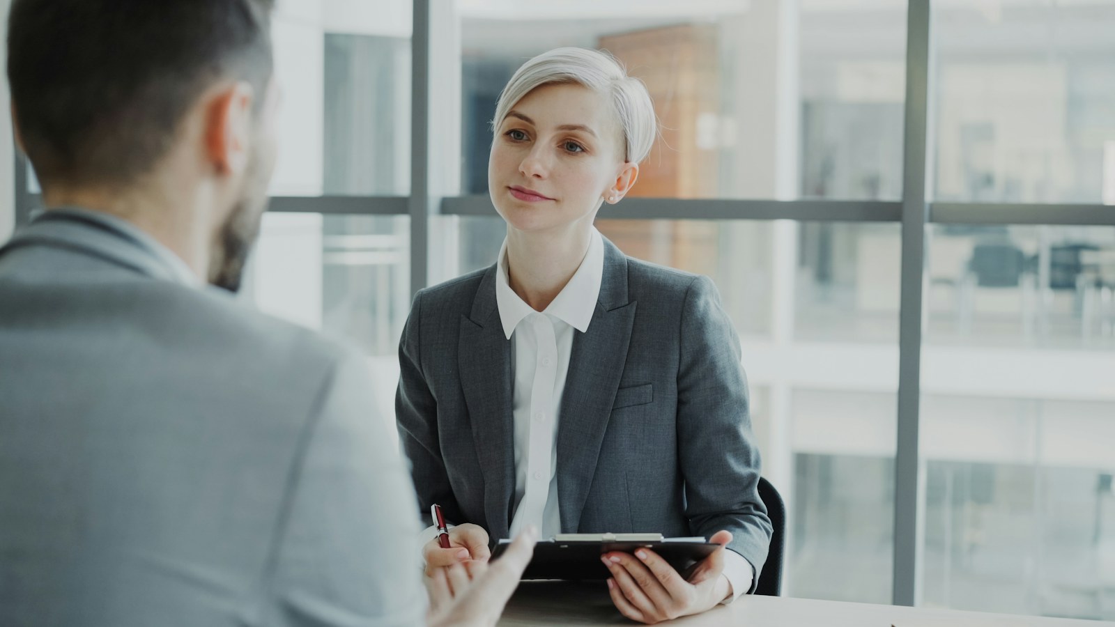 Candidate asking thoughtful questions during an office interview